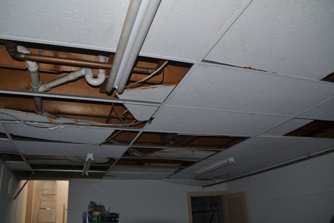 A Photo of water damage restoration https://images.vc/image/471/water-damage-to-a-drop-ceiling-due-to-a-fire-time-2022-11-14-03-29-41-utc.jpg