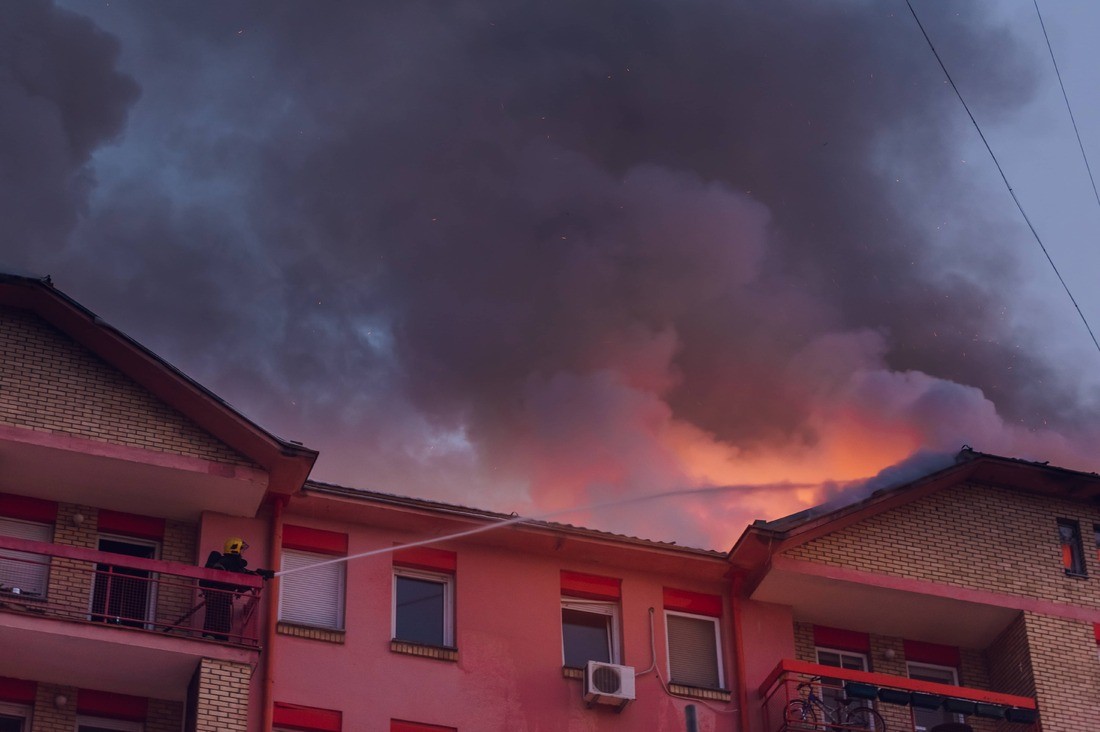 A Photo of Fire Damage Contractors https://images.vc/image/4jr/firefighter-on-a-balcony-put-out-a-fire-in-a-burni-2022-03-29-07-08-11-utc.jpg