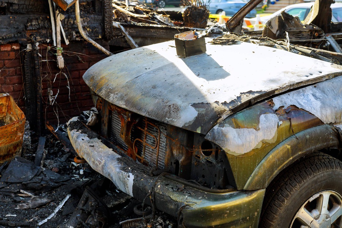 A Photo of fire damage cleanup https://images.vc/image/4jz/the-car-after-the-fire-burnt-out-car-with-an-open-2022-11-12-10-54-00-utc.jpg