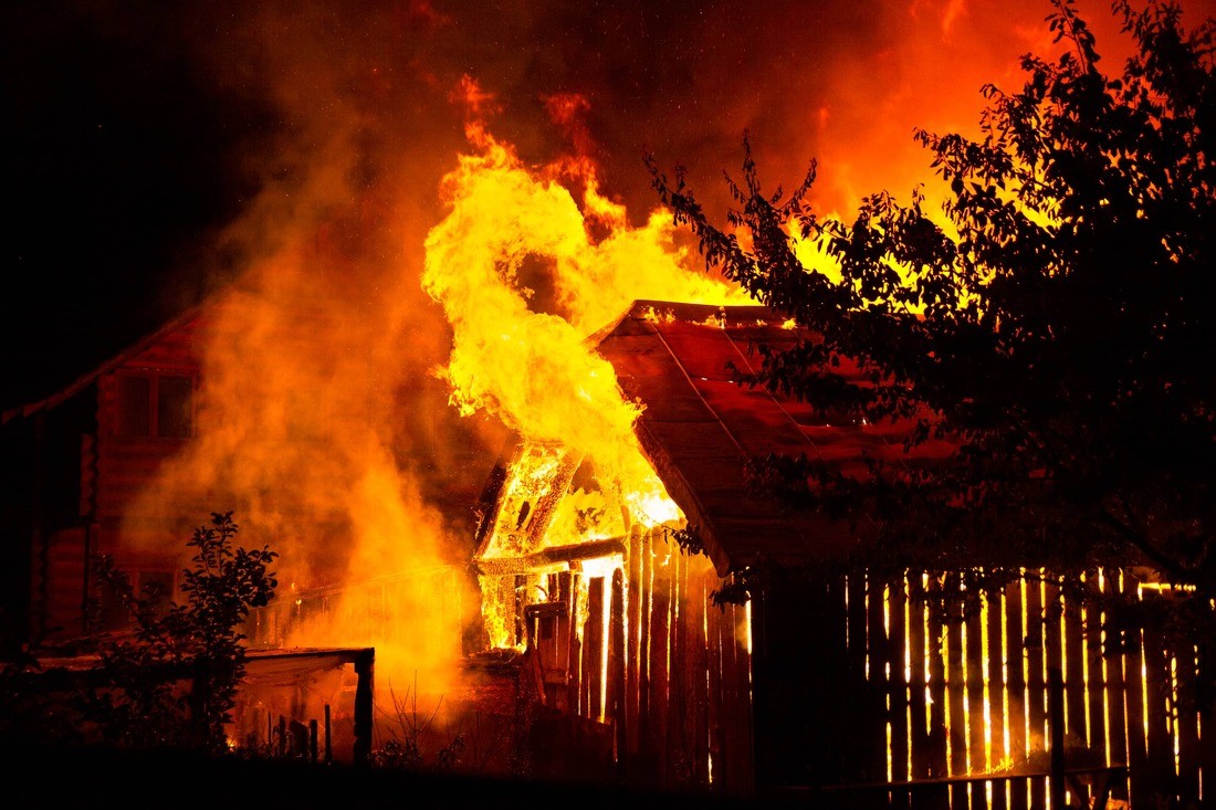 A Photo of smoke damage cleanup https://images.vc/image/4kk/wooden-house-or-barn-burning-on-fire-at-night-2022-01-25-03-33-07-utc.jpg